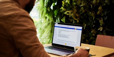 Man using Microsoft Word on Laptop