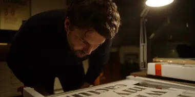 Foundry Stories - Rene Still A still image from Foundry Stories showing Rene Bieder in his studio looking at type.