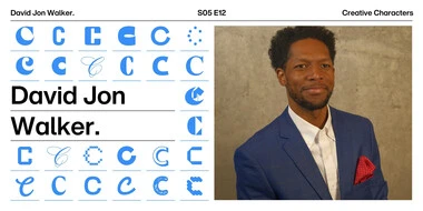 Headshot of David Jon Walker in a blue suit coat with red handkerchief