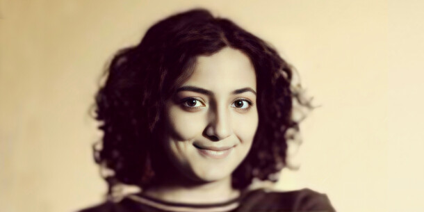 Vaishnavi Murthy Yerkadithaya headshot in sepia.