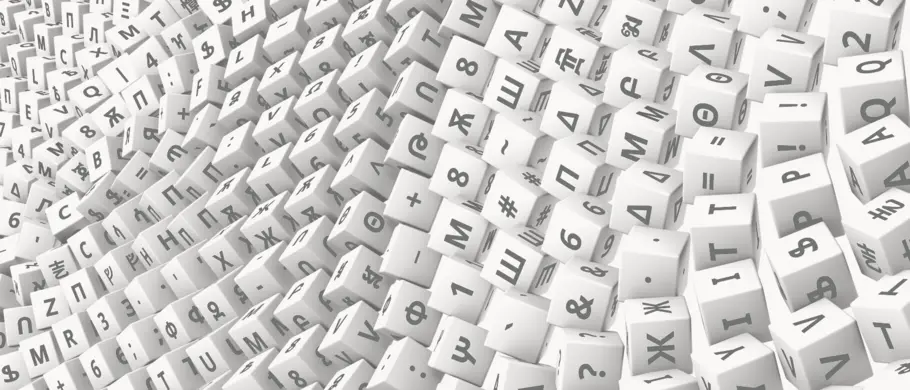 A rolling cascade of cubes, with various glyphs from different languages, as well as punctuation, on each side