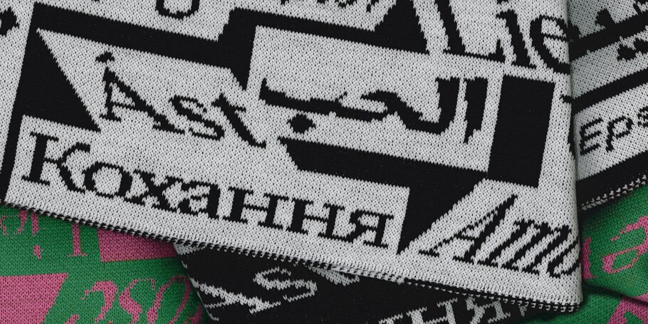 Typography in black and white stitched on a scarf 